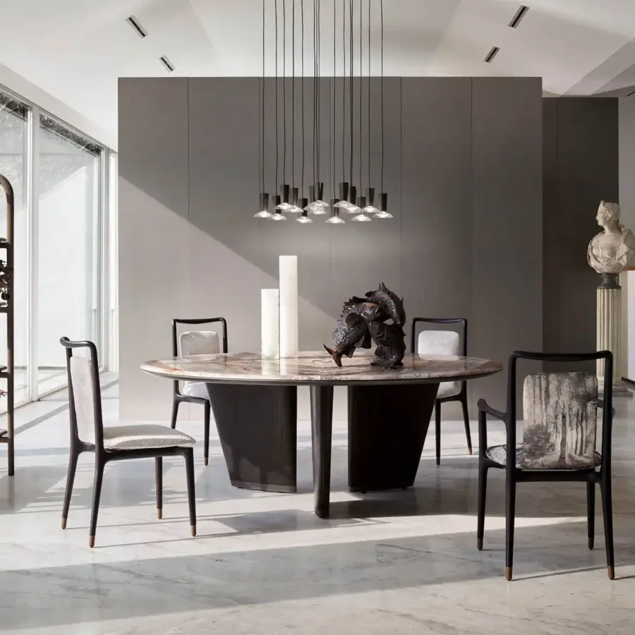 Exceptional Giorgetti Mistral round table with a marble top and bronze insert supported by veneered ash wood with a dark matte finish