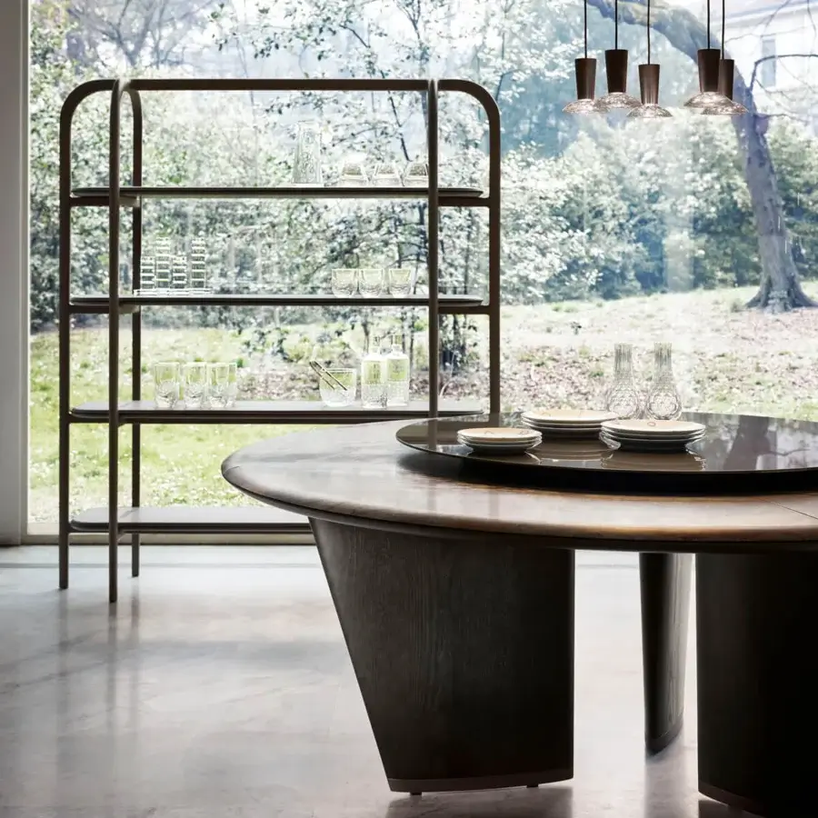 Distinguished Giorgetti Mistral round table with a marble top, bronze insert, and veneered ash wood legs in a lacquered titanium plinth