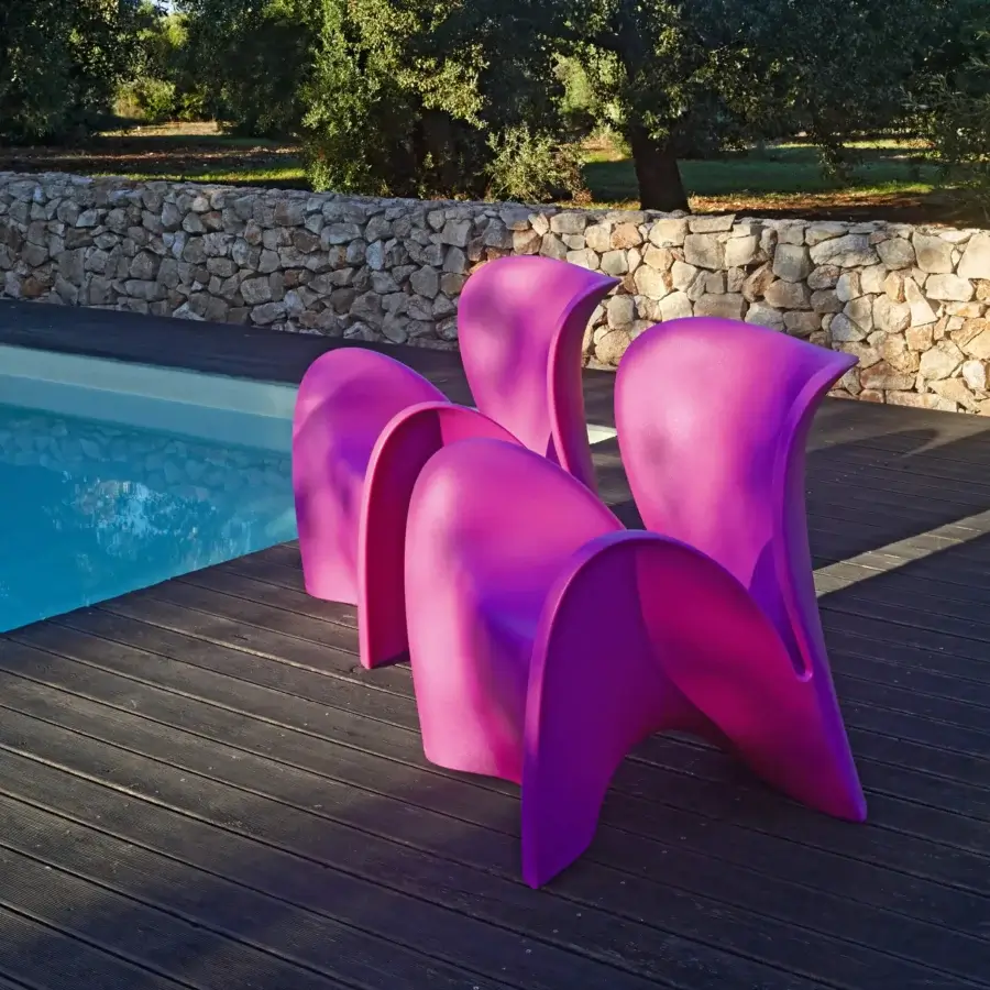 Captivating MY YOUR Lily lounge chair crafted in pink molded synthetic material with a smooth matte finish