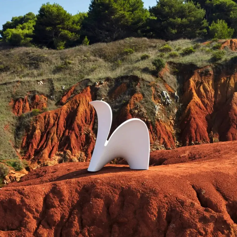 Sophisticated MY YOUR Lily lounge chair molded in glossy white synthetic material with organically curved form