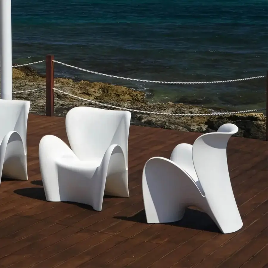 Exceptional MY YOUR Lily lounge chair with flowing organic form sculpted in glossy white synthetic material