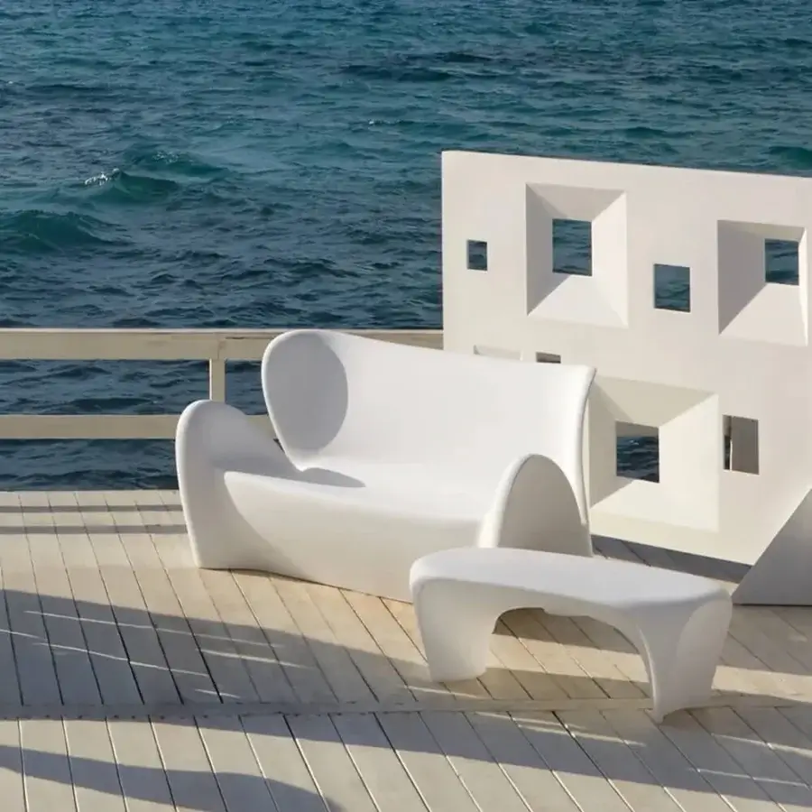 Exceptional MY YOUR Lily sofa with poetically curved form crafted in smooth matte synthetic material