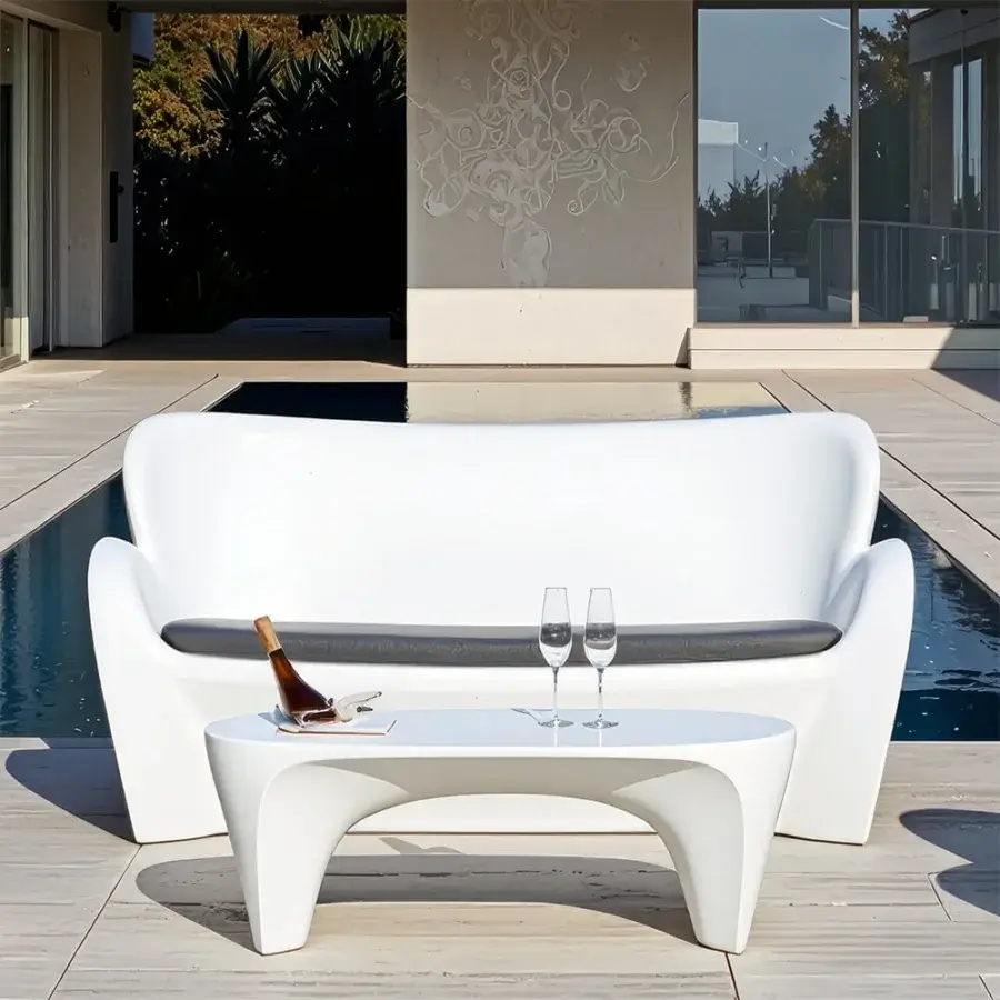 Exceptional MY YOUR Lily sofa with organically curved form crafted in smooth white synthetic material and glossy finish