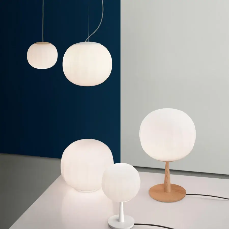 Distinguished Luceplan Lita table lamp with opaline blown-glass diffuser and refined brass support in satin finish