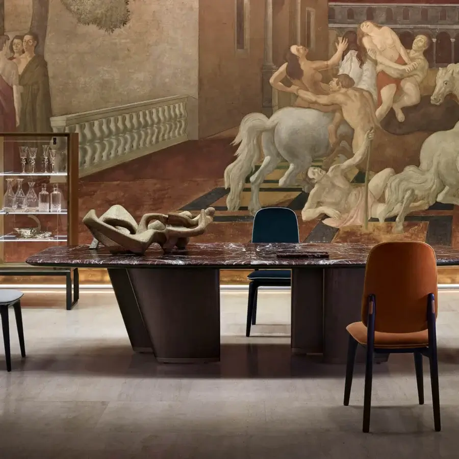 Elegant Giorgetti Mistral table with marble top exhibiting natural veining, veneered ash wood legs, and lacquered titanium under-top