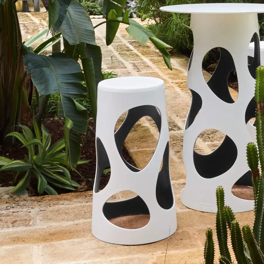 Distinguished MY YOUR Liberty stool in black synthetic material with a smooth matte finish and unique perforated cylindrical form
