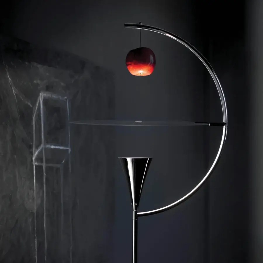 Captivating Nemo Newton floor lamp crafted in sleek metal with glossy silver finish and integrated red apple detail