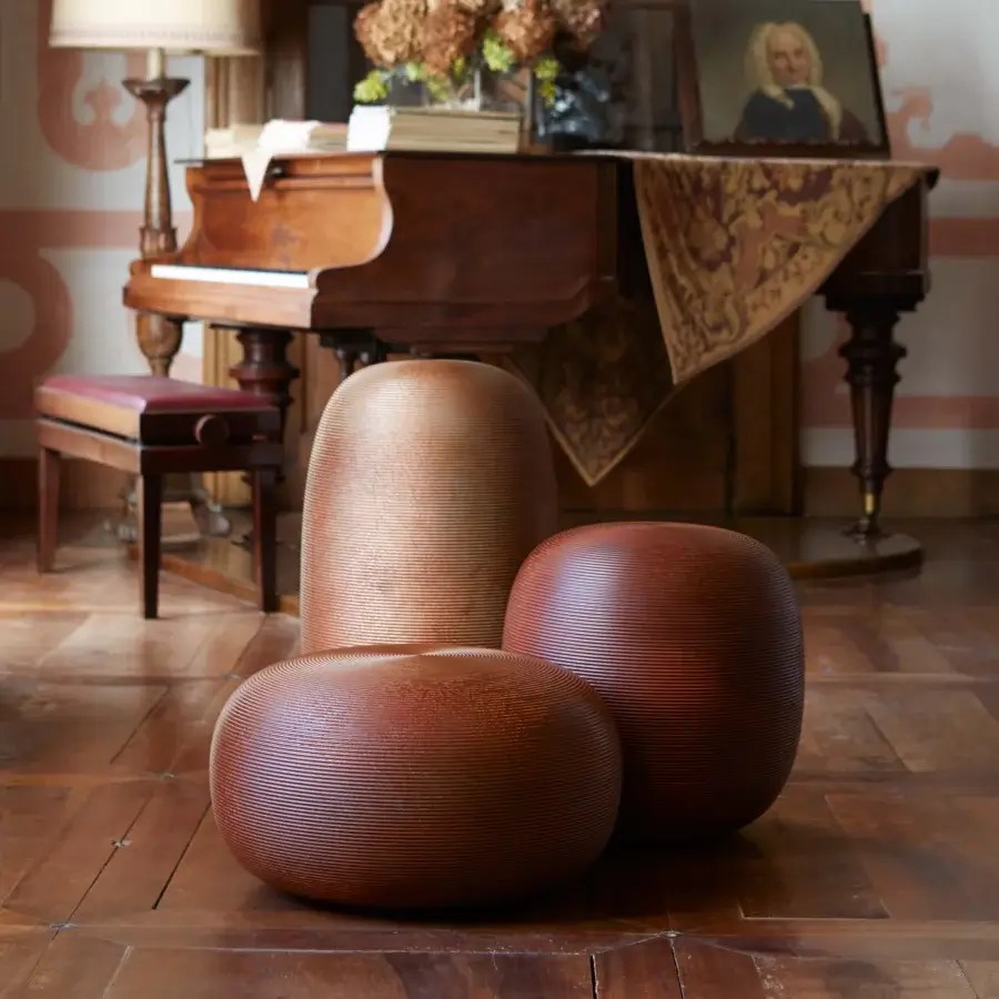 Superior MY YOUR Pandora stool with gently curved form and warm reddish-brown textured wood construction in satin finish