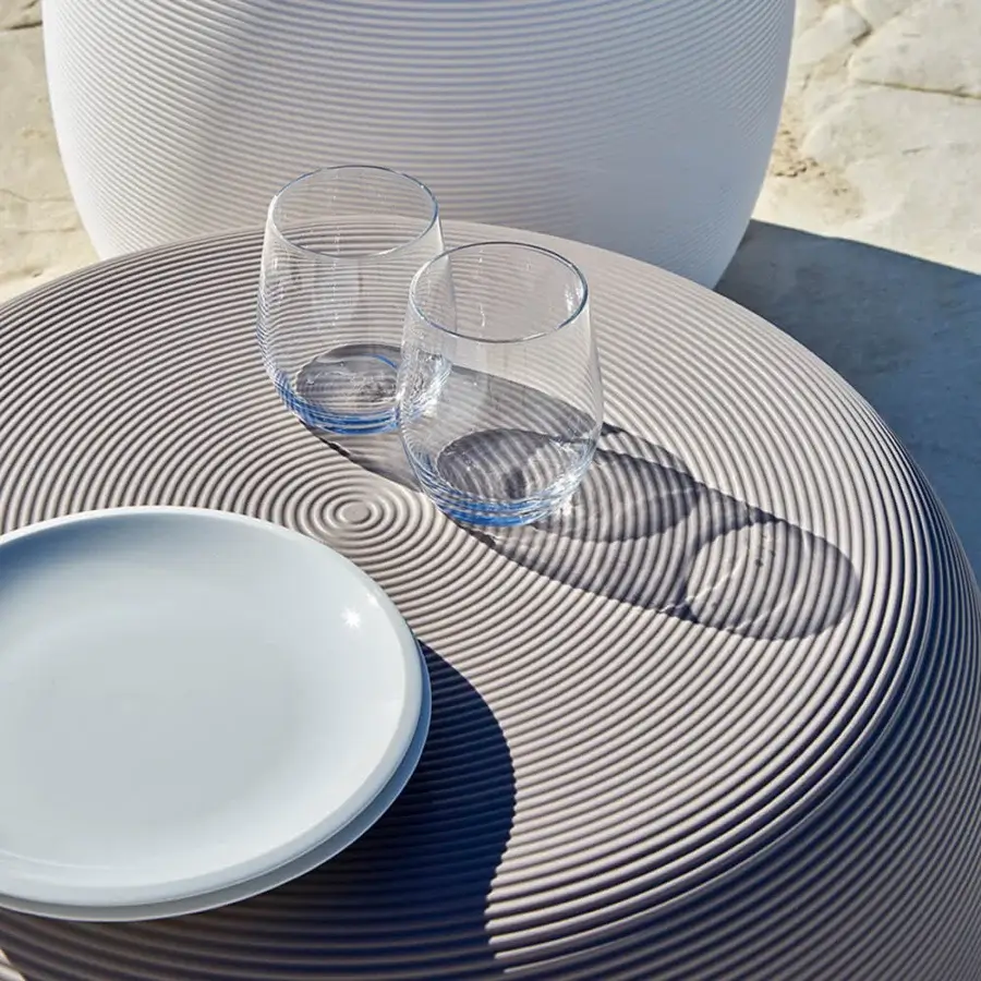 Distinguished MY YOUR Pandora coffee table with subtly textured circular tabletop and muted gray synthetic material finish