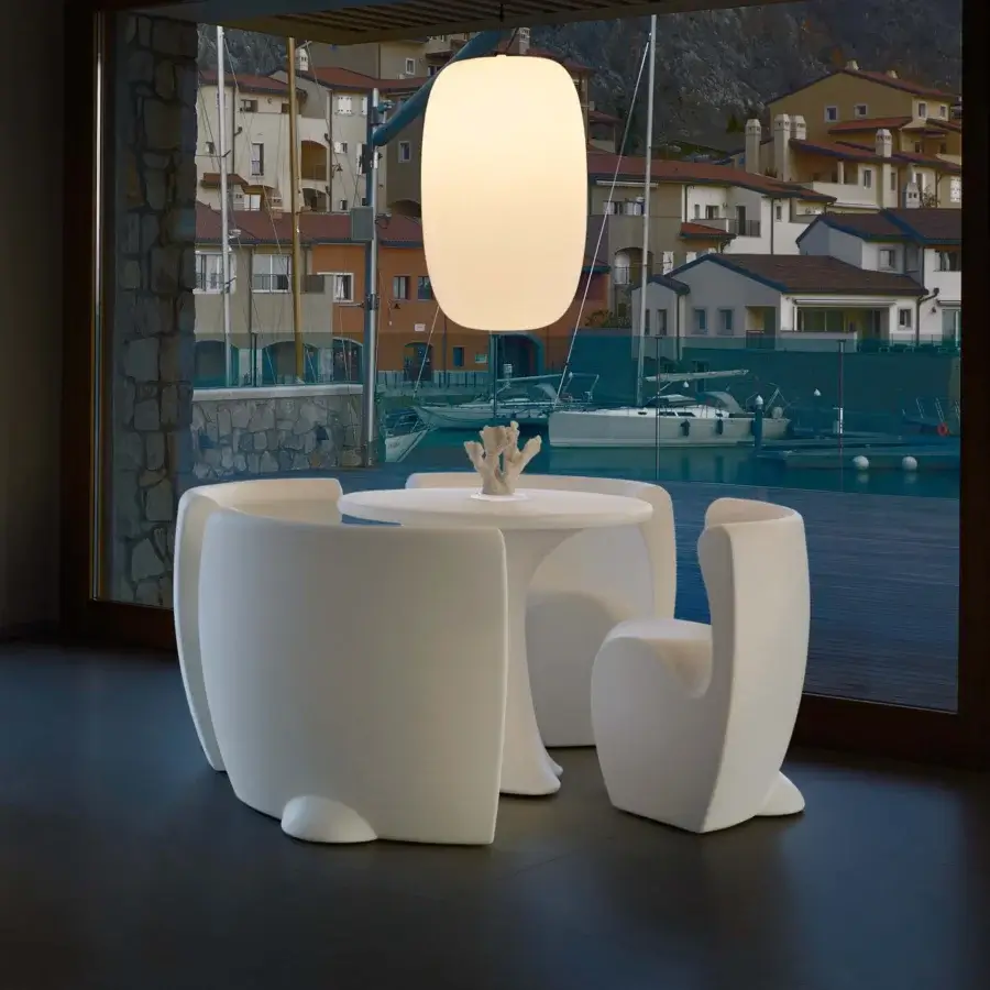 Captivating MY YOUR Rhonda chair with organically rounded form and glossy white synthetic material build