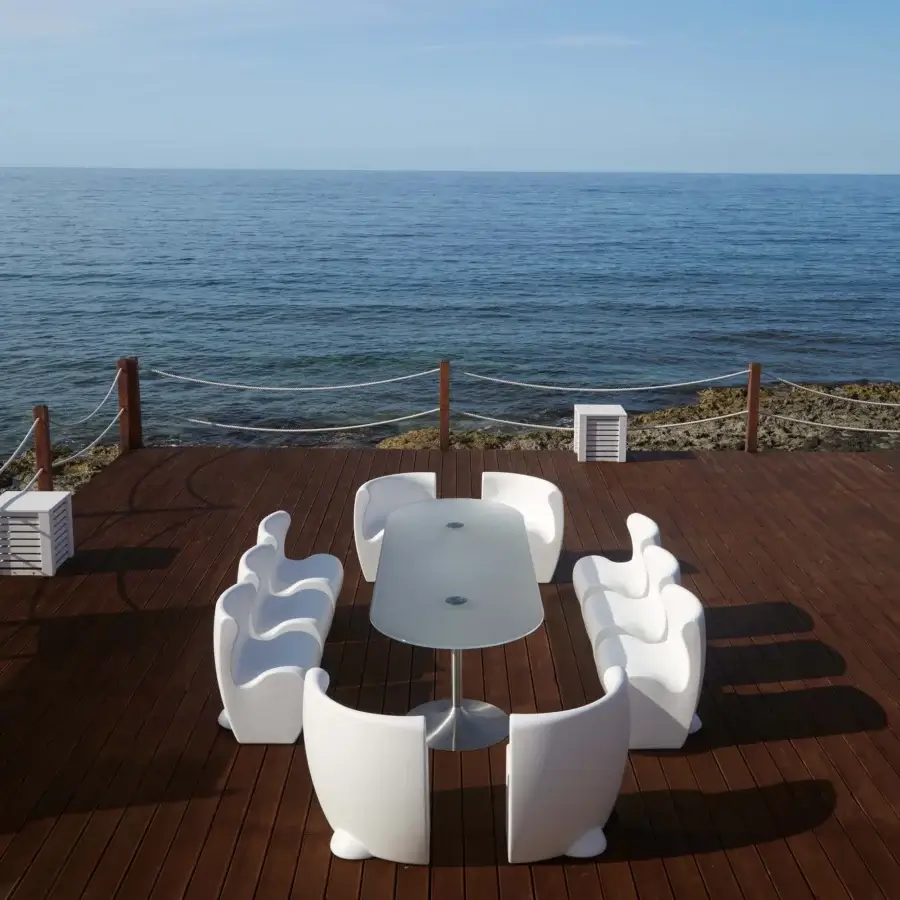 Captivating MY YOUR Rhonda chair with smooth matte white synthetic material and enveloping organic curved form crafted in Italy