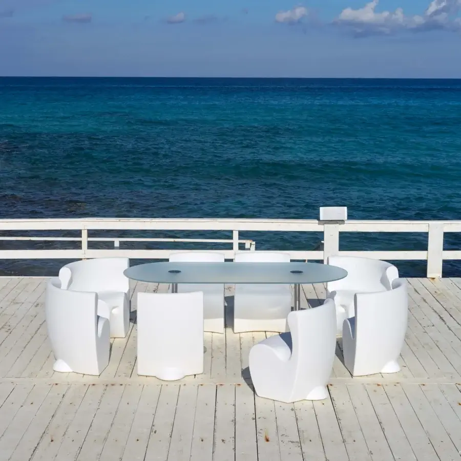 Superior MY YOUR Rhonda chair with enveloping form molded in uniformly white synthetic material built with outflow channels