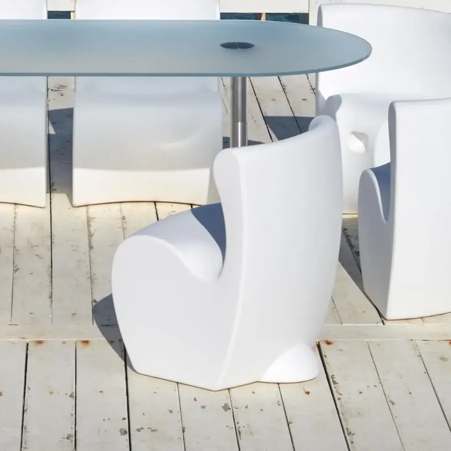 Distinguished MY YOUR Rhonda chair with sculpted organic form crafted in uniformly white matte synthetic material for outdoor use