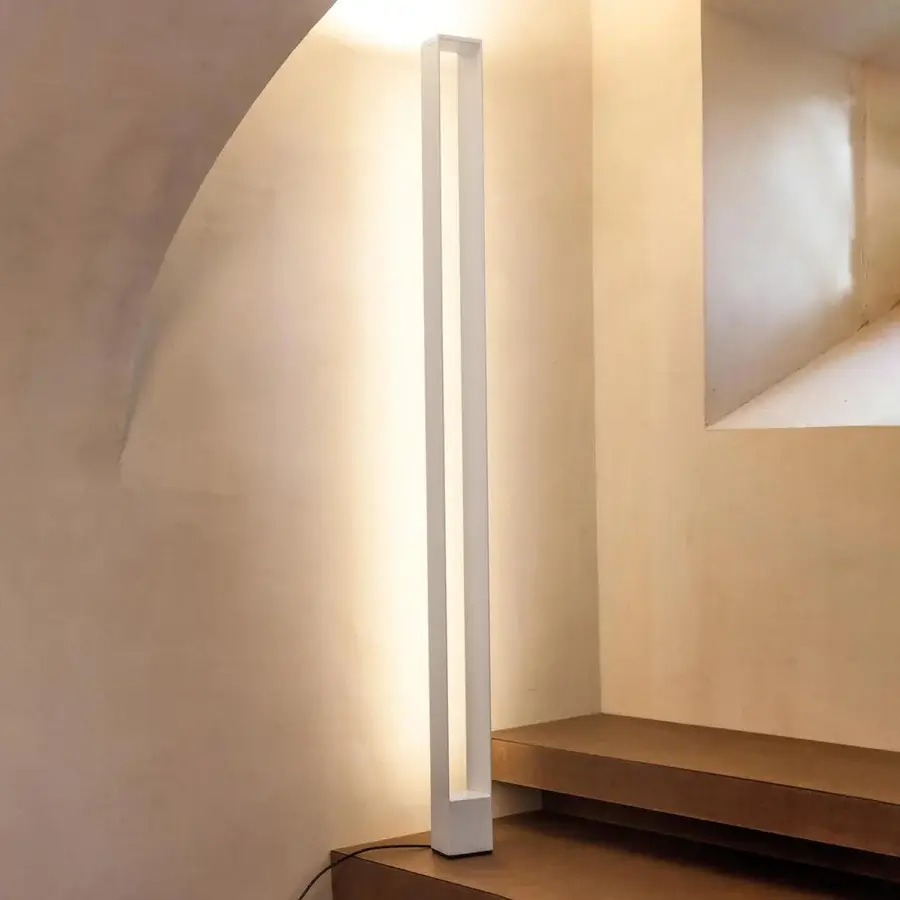 Superior Nemo Tru floor lamp with tall rectangular silhouette crafted in aluminum and polycarbonate with diffused glow