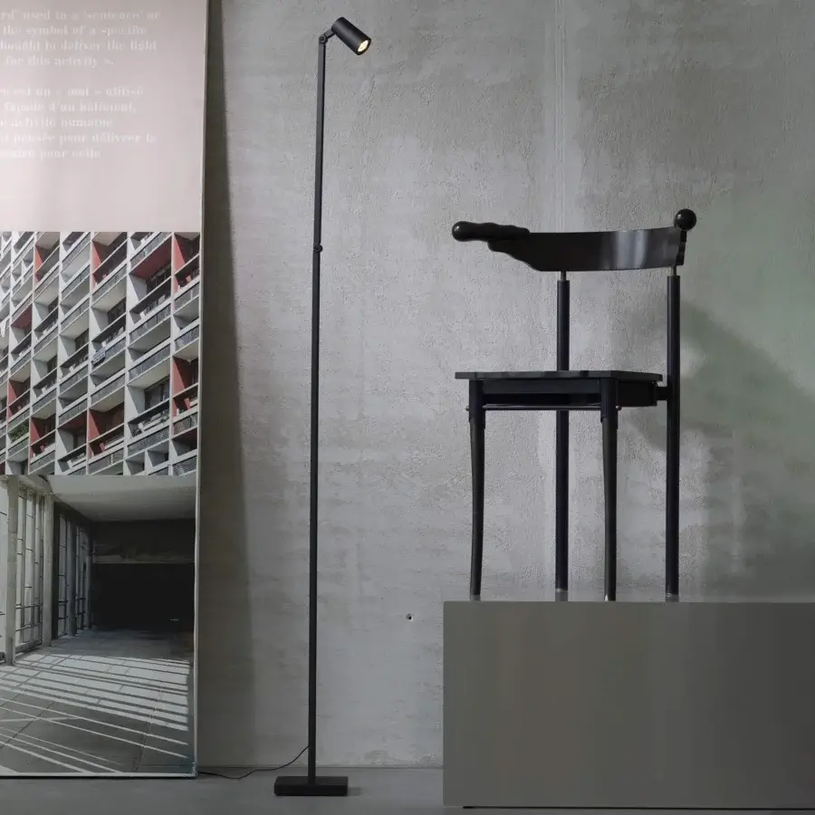 Exceptional Untitled Reading Floor Lamp with metal construction and matte black finish delivers focused illumination