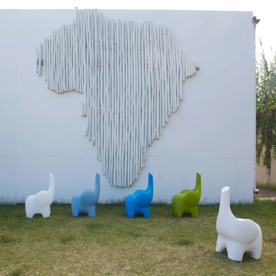 Distinguished MY YOUR Tino chair crafted in light blue Poleasy® with a unique elephant form and smooth contemporary silhouette