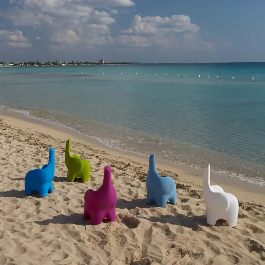 Captivating MY YOUR Tino chair evoking an elephant form with a smooth matte finish in vibrant magenta Poleasy plastic