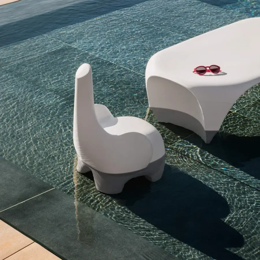 Distinctive MY YOUR Tino chair shaped like an elephant crafted from glossy Poleasy® plastic with entirely curved lines for contemporary design