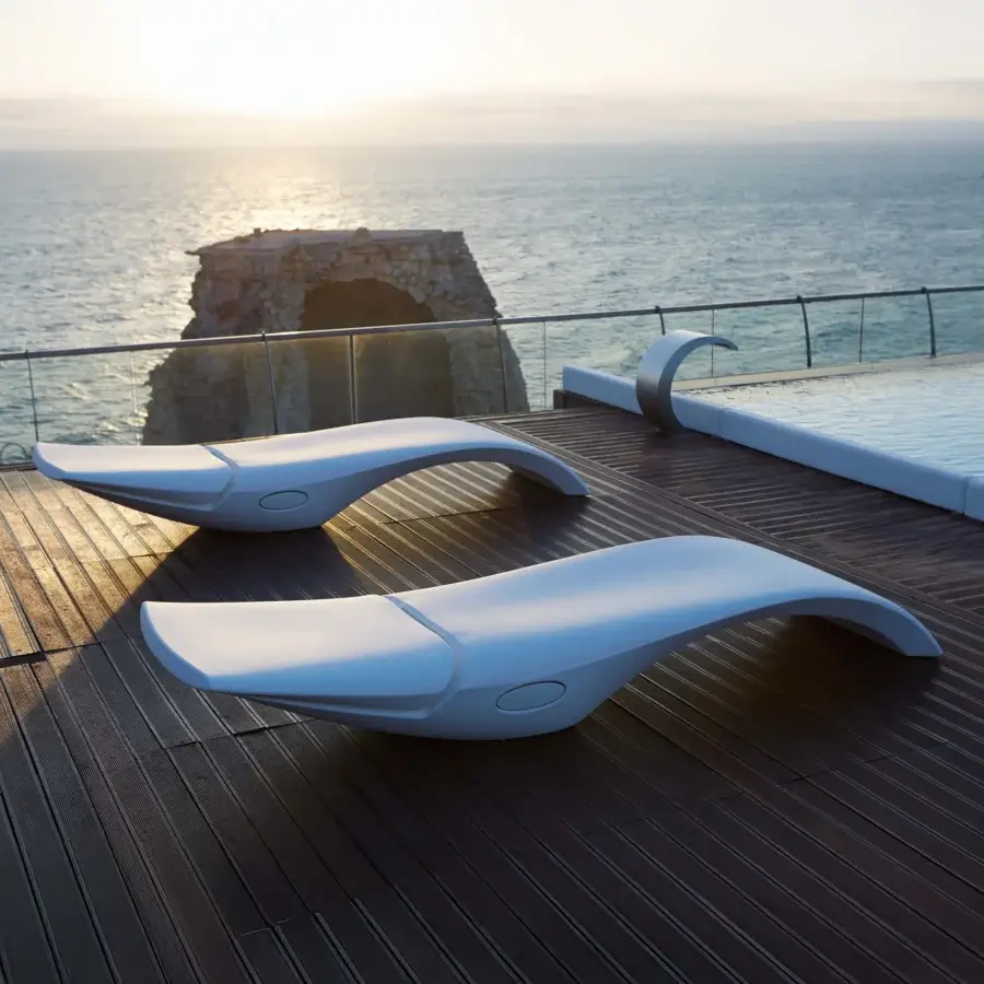 Superior MY YOUR Zoe Lounger, a refined lounger crafted in white Poleasy® with fully chromed metal devices and seamless headrest