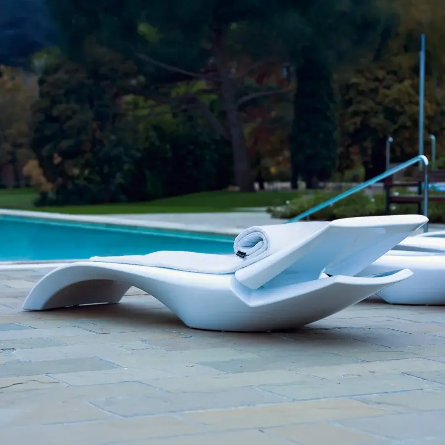 Elegant MY YOUR Zoe Lounger, a white lounger crafted with a durable Poleasy® shell and fully chromed metal components with a glossy finish