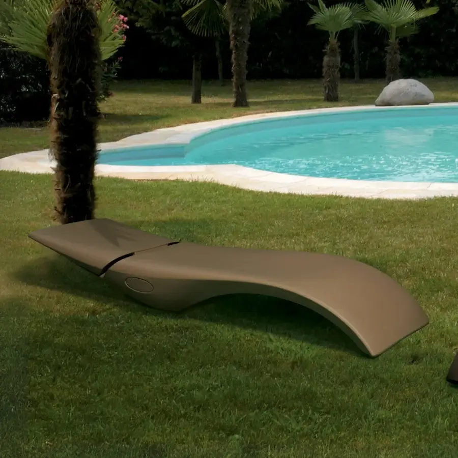 Elegant MY YOUR Zoe Lounger, a contemporary lounger crafted in a muted brown Poleasy® shell with fully chromed metal components