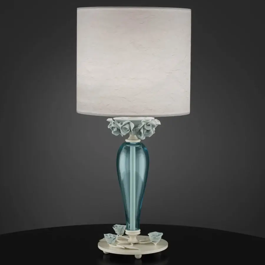 Elegant Euroluce Bora lamp crafted in teal glass with pale green sculpted floral motifs and a light beige textured lampshade