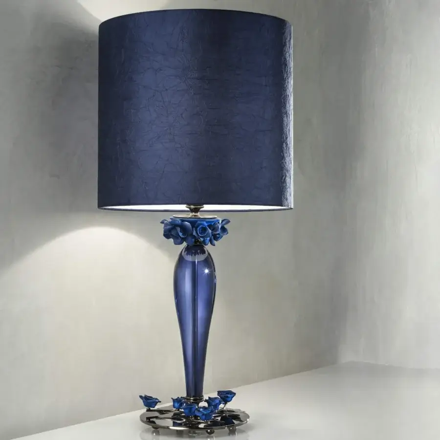 Distinguished Euroluce Bora lamp crafted in translucent blue glass with a dark blue textured textile lampshade and sculpted floral details