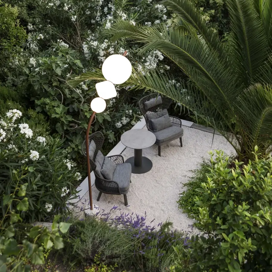 Exceptional Lanzavecchia-Wai Joy floor lamp crafted in dark copper-finish metal with four opaque white Poleasy lampshades along a curved form