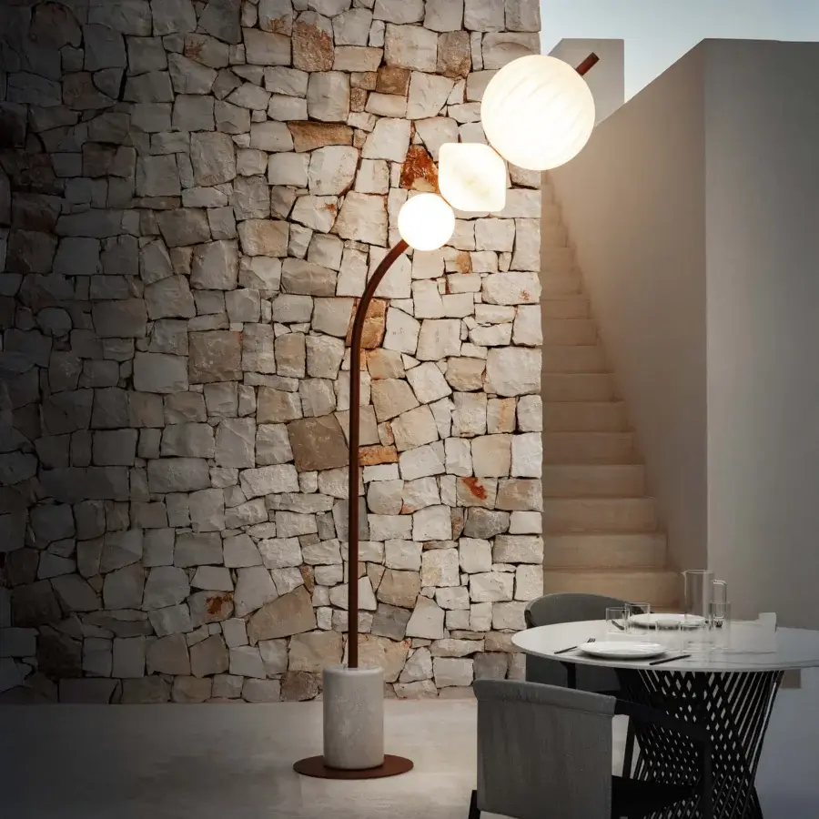 Distinguished Lanzavecchia-Wai Joy floor lamp with a marble base, warm copper finish, and opaque white Poleasy lampshades