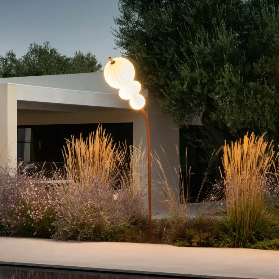 Captivating Lanzavecchia-Wai Joy floor lamp with a marble base, copper-finish metal stem, and translucent flower bud-like lampshades