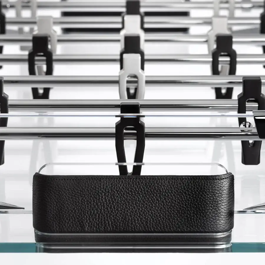 Exceptional Impatia Derby wood foosball table with a transparent glass base and glossy silver-black accents