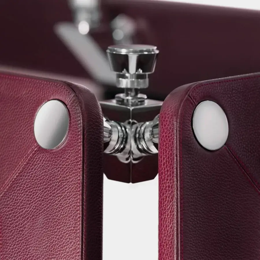 Lavish Impatia Lungolinea table tennis table with burgundy Italian leather surface and polished silver-toned metallic accents in a matte finish