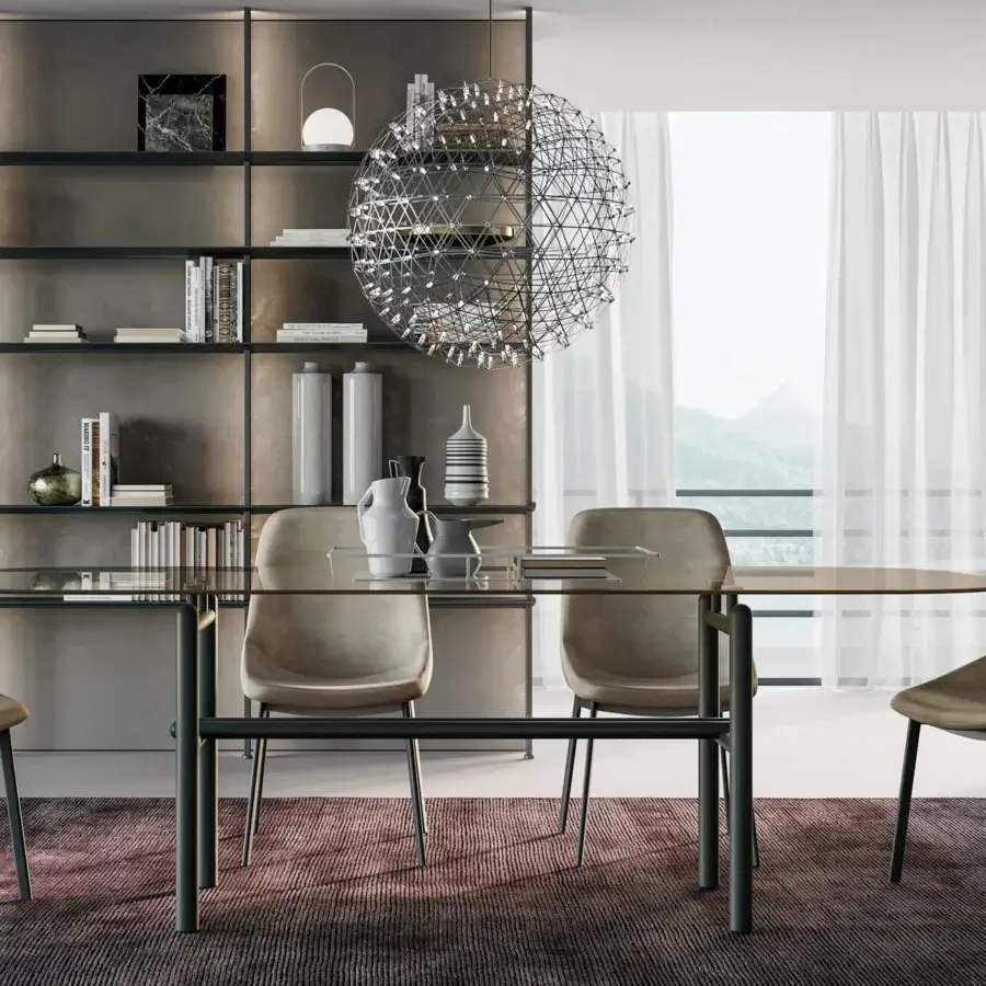 Superior Dallagnese Supernova table with gently rounded glass top and disciplined dark-toned metal tube base crafted in Italy