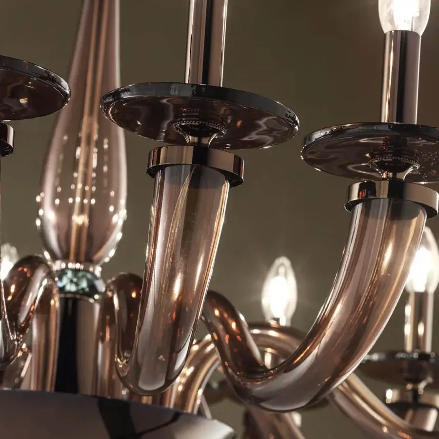 Distinguished Euroluce Olympia chandelier crafted in Italy with warm brown finish, sculptural arms, viridian crystal and hand-blown glass