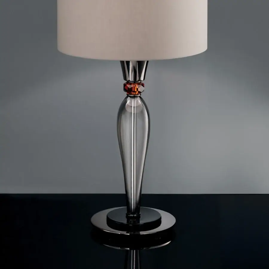Distinctive Euroluce Olympia table lamp with curved glass body and faceted topaz crystal sphere in polished black nickel