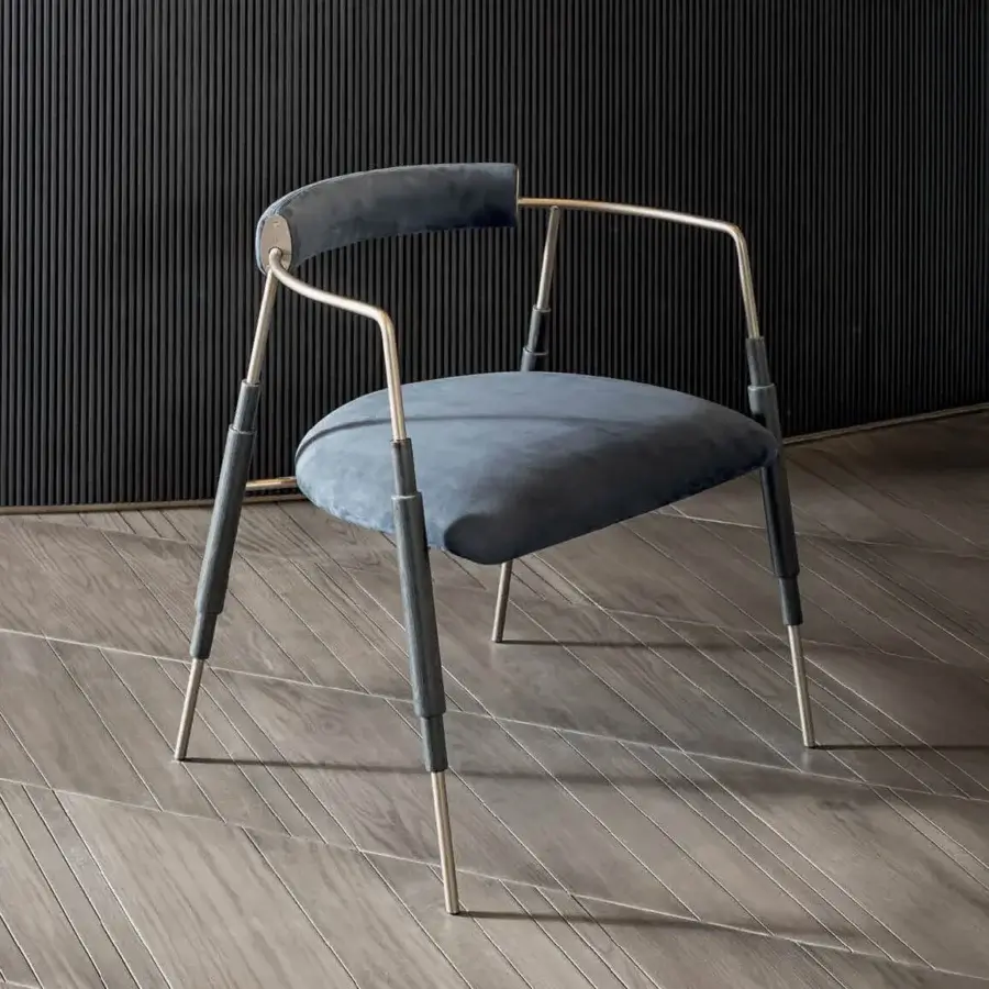 Captivating Shake Frame armchair with varnished steel structure, solid ash wood legs and muted blue velvet-like textile upholstery