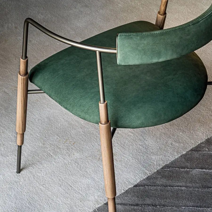 Distinguished Shake Frame armchair with varnished steel, solid ash wood details, and sumptuous green velvet upholstery