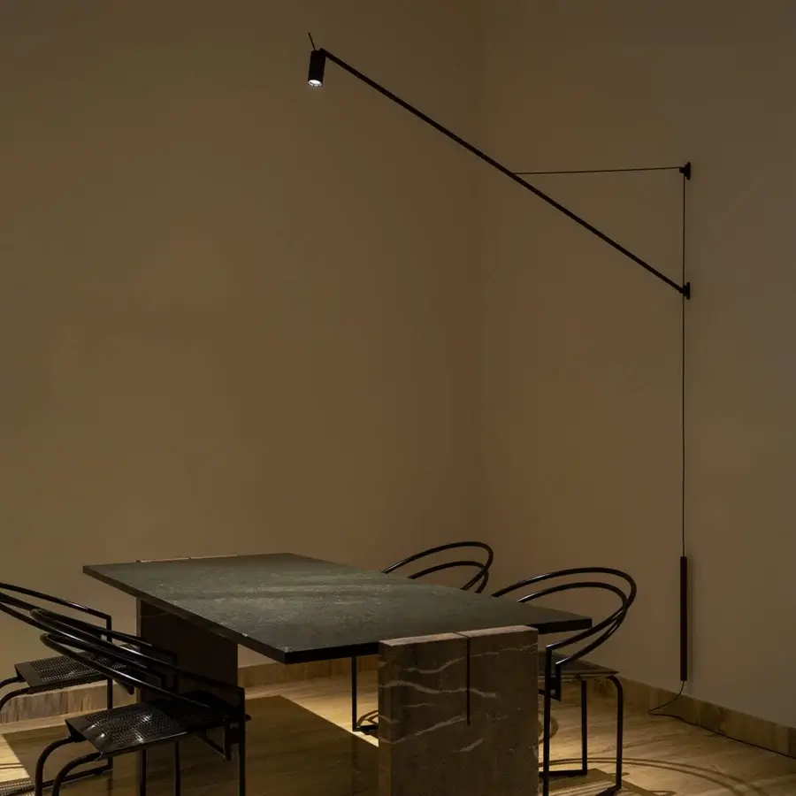 Distinguished Nemo Lighting Swan wall lamp crafted in matte black metal with adjustable arm and leather counterweight