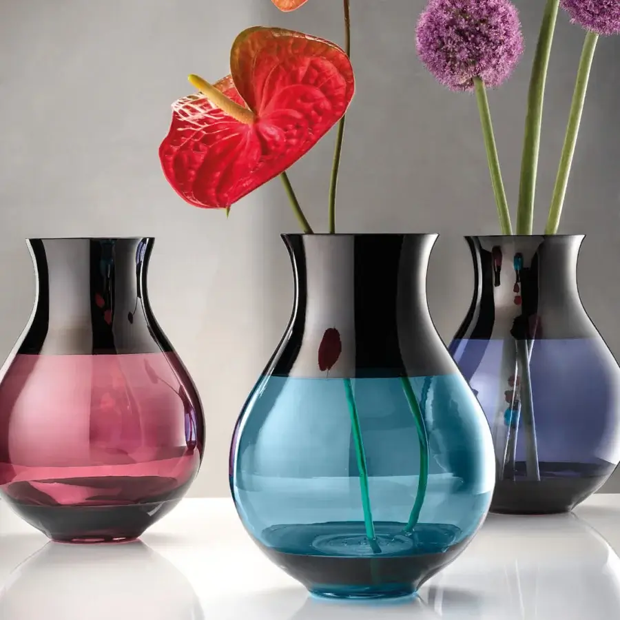 Captivating Euroluce Infinity vase crafted in expressive glass with a gradient from lighter purple to darker tones and a black nickel finish