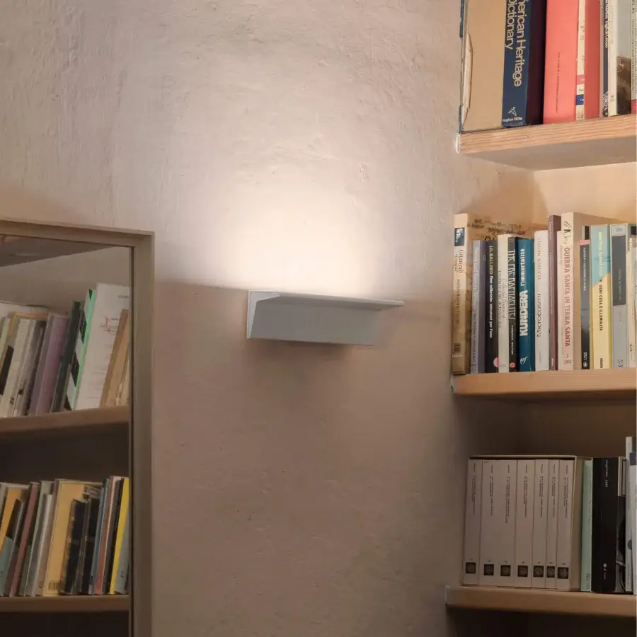 Elegant Nemo Lighting Zena wall lamp crafted in recyclable aluminum with a smooth matte white finish