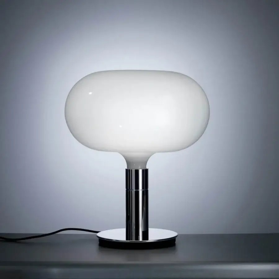 Elegant Nemo AM1N table lamp crafted in white hand-blown glass with a bright silver polished metal stem and base