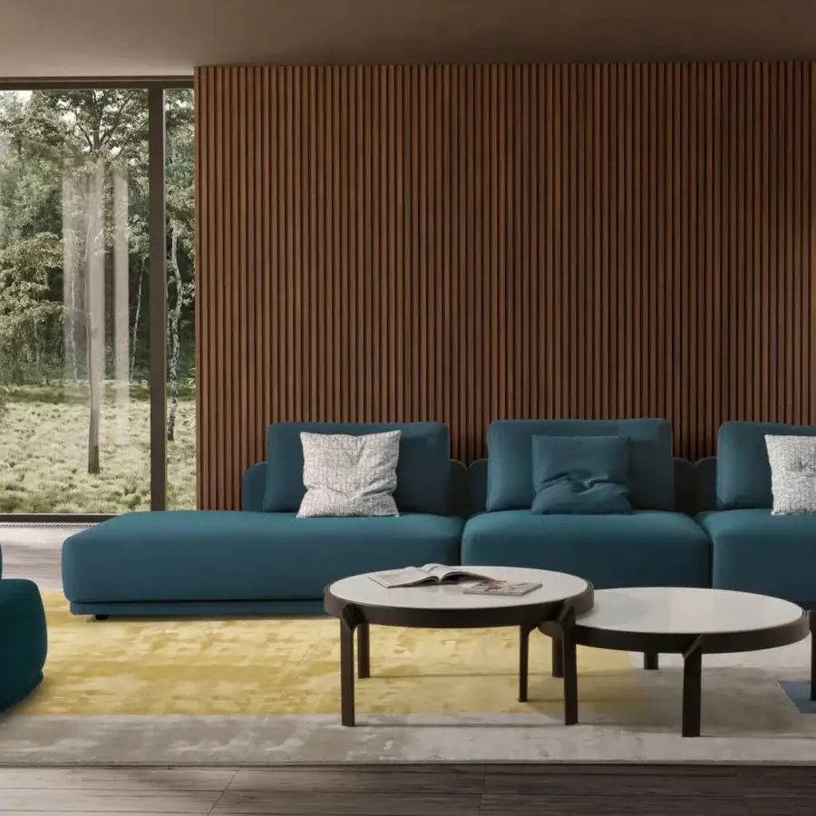 Superior CTS Salotti Navona lounge chair with gently curved ergonomic form in deep teal textured textile and subtly satin finish