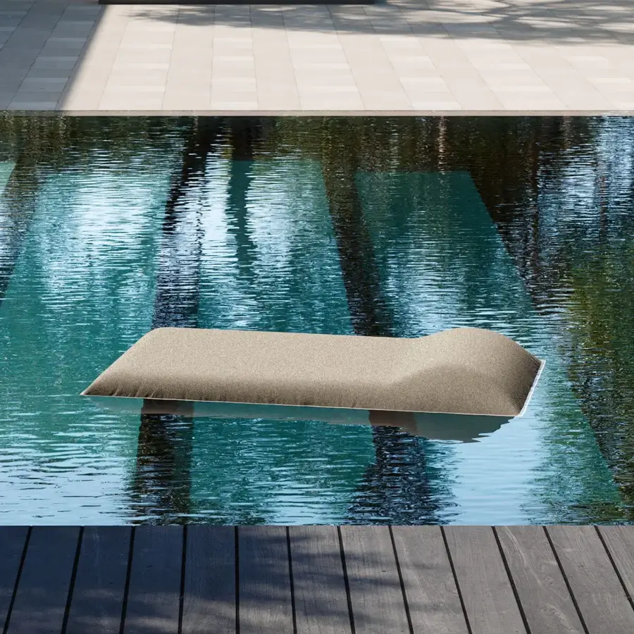 Innovative Louis floating lounger with muted gray textile and undulating form for tranquil water relaxation
