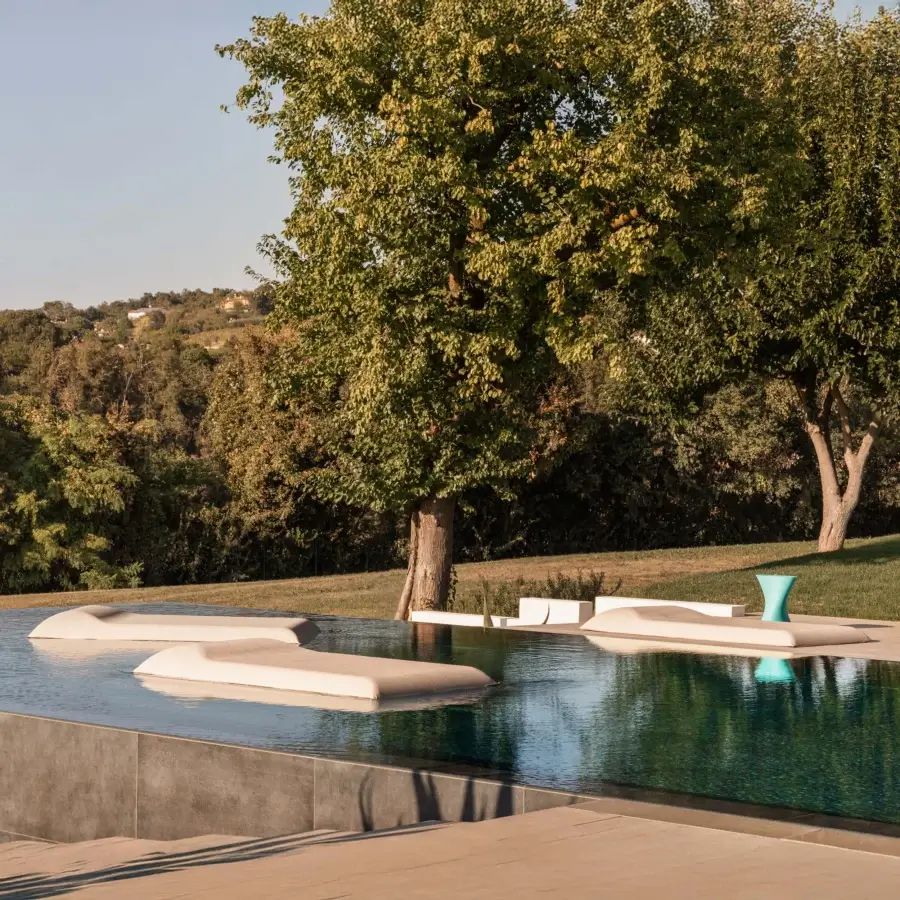 Superior MY YOUR Louis floating lounger with organic form and seamless molded synthetic construction in pale beige finish