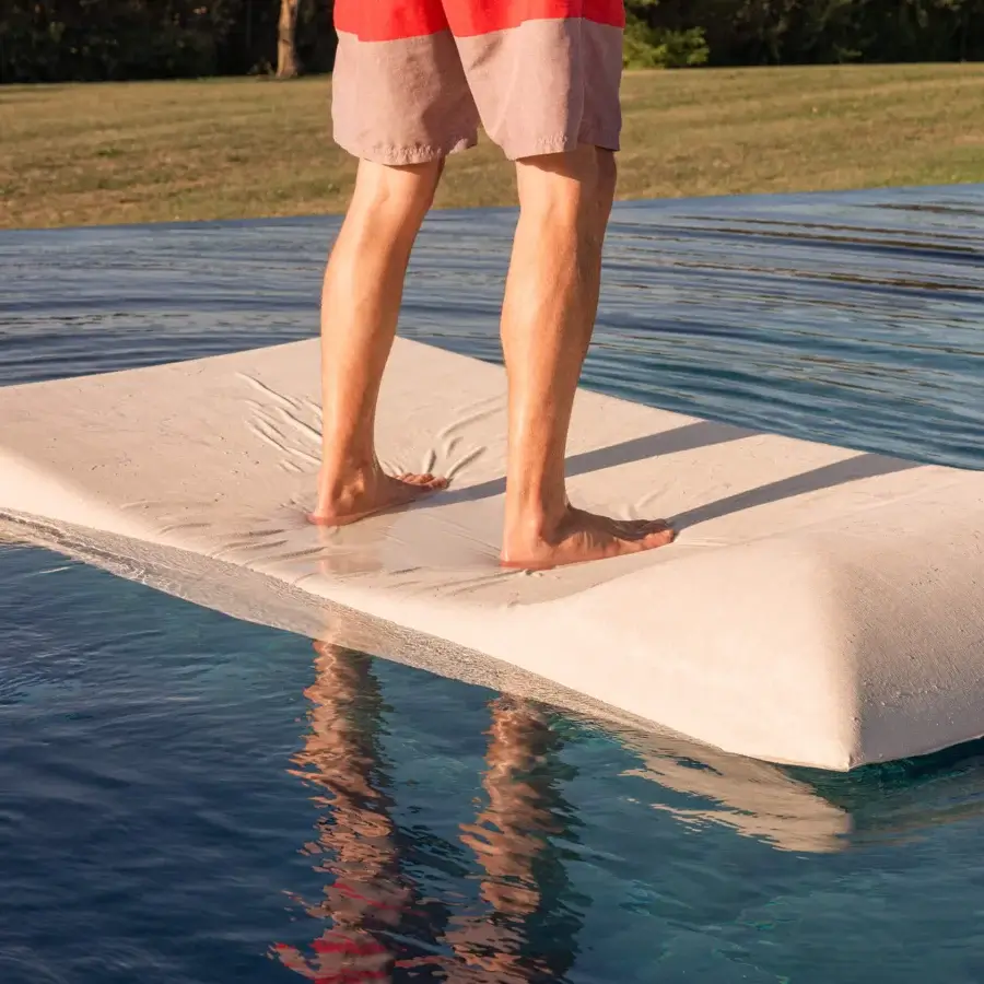 Elegant MY YOUR Louis floating lounger crafted in Italy with smooth, textured synthetic material and gently curved profile
