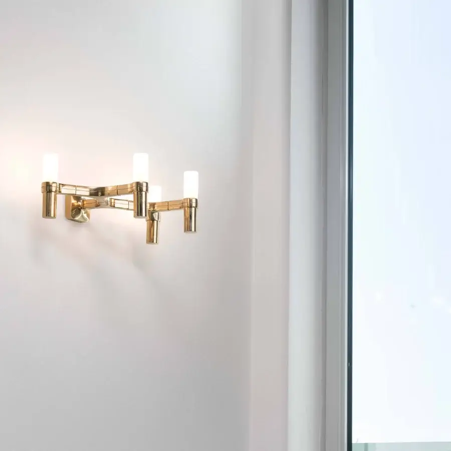 Elegant Nemo Crown Wall Lamp, a contemporary fixture crafted in golden metal with satin sheen and opaque white glass shades