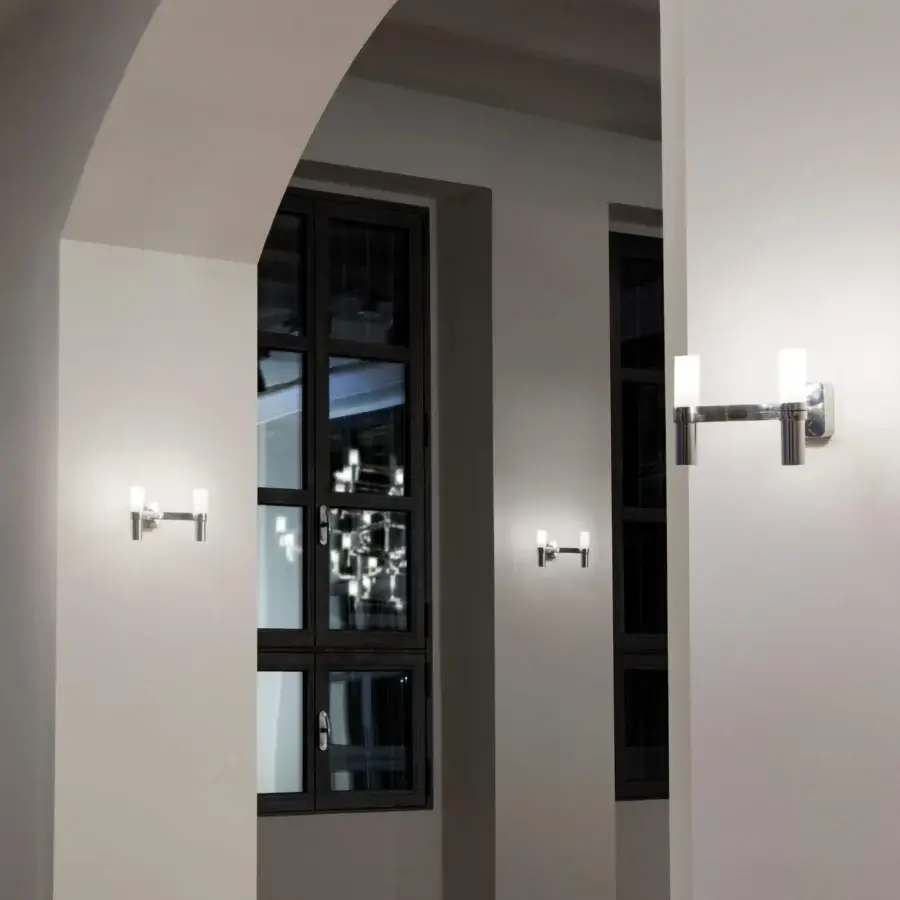 Distinguished Nemo Crown Wall Lamp, a contemporary fixture in polished metal with frosted glass and a silver tone