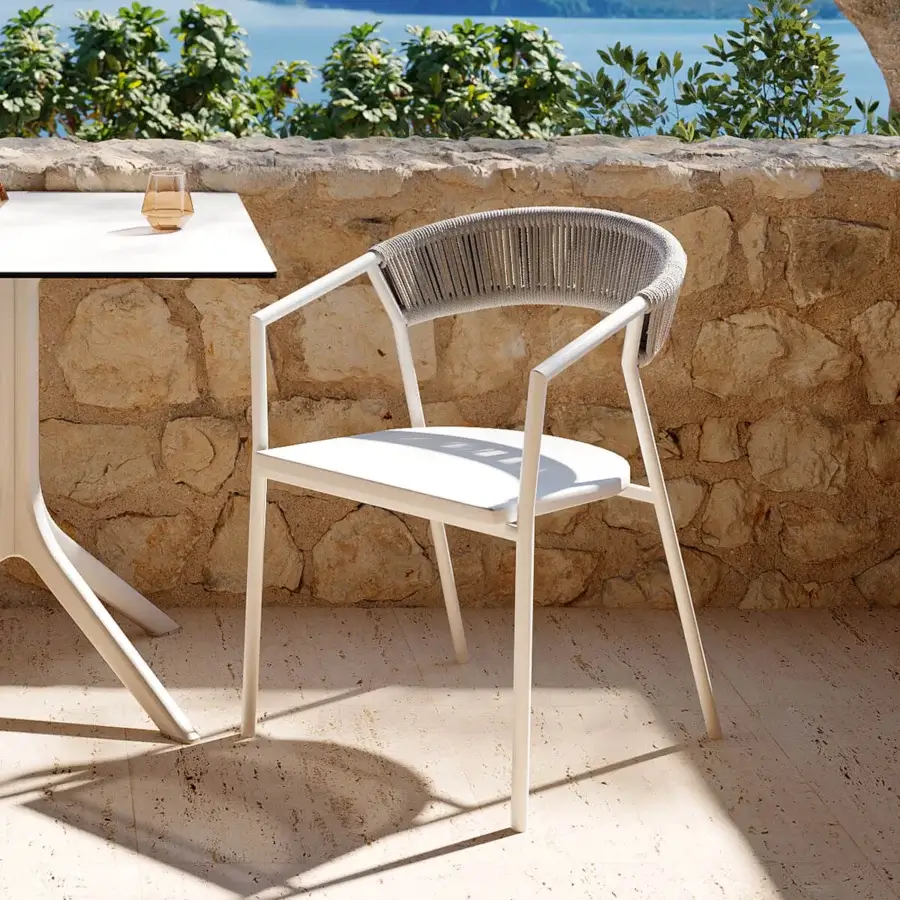 Sophisticated MY YOUR Maja armchair crafted with a powder-coated aluminum frame and gray woven synthetic fiber backrest in textilene