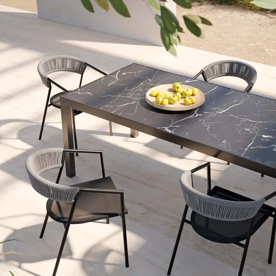 Superior MY YOUR Maja table built with dark stone-like tabletop and sleek matte black metal base with polished finish