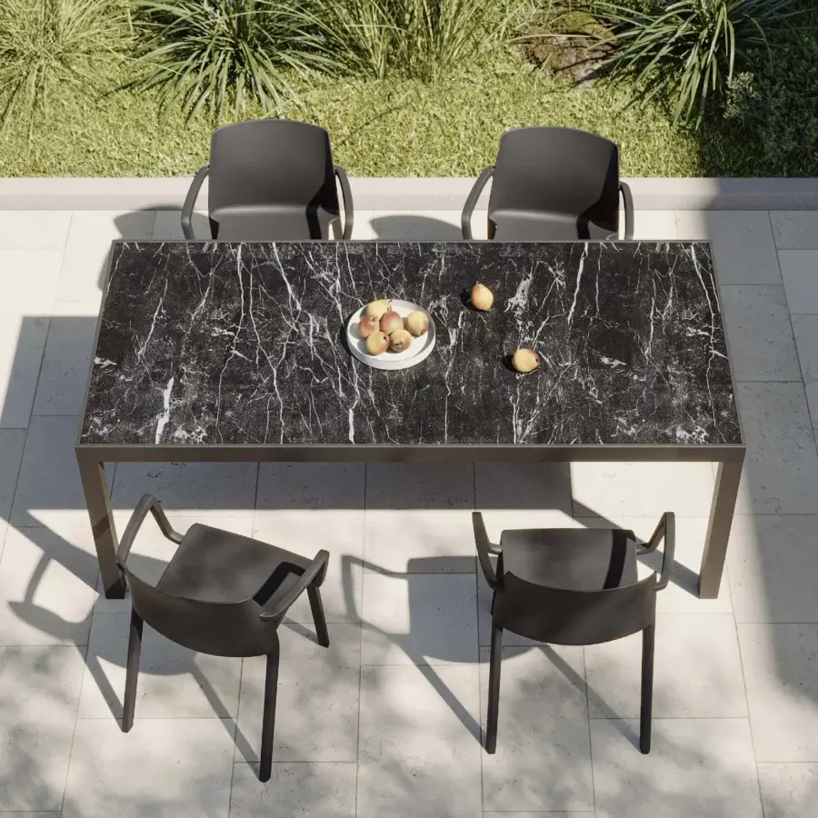 Elegant MY YOUR Maja table built with marble-like tabletop and glossy finish supported by matte black metal legs